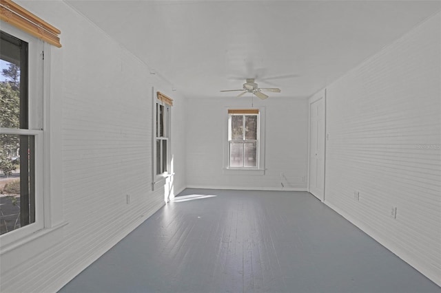 unfurnished room featuring ceiling fan and wood-type flooring