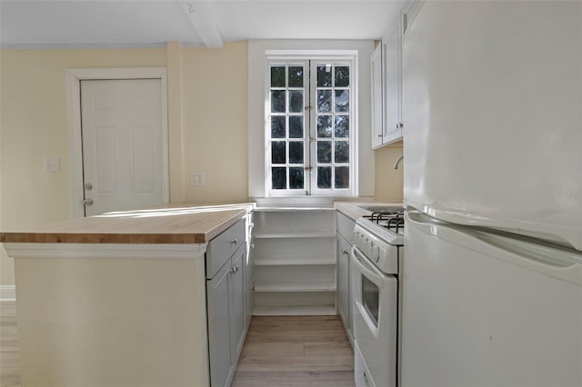 kitchen featuring white cabinetry, white appliances, and light hardwood / wood-style flooring