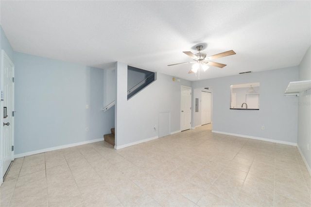 interior space with ceiling fan