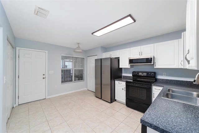 kitchen featuring sink, white cabinets, and appliances with stainless steel finishes