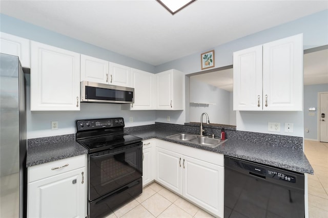 kitchen featuring white cabinetry, sink, light tile patterned floors, and black appliances