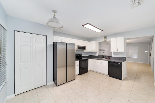 kitchen with light tile patterned flooring, sink, white cabinetry, pendant lighting, and black appliances