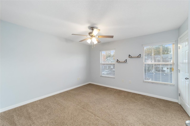 carpeted empty room with ceiling fan