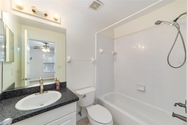 full bathroom featuring vanity, toilet, and tiled shower / bath