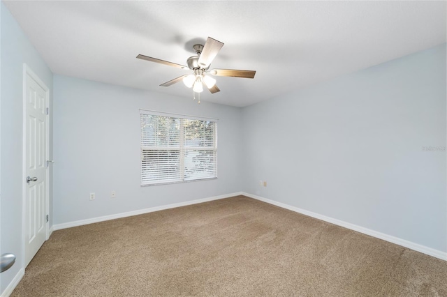 empty room featuring ceiling fan and carpet floors