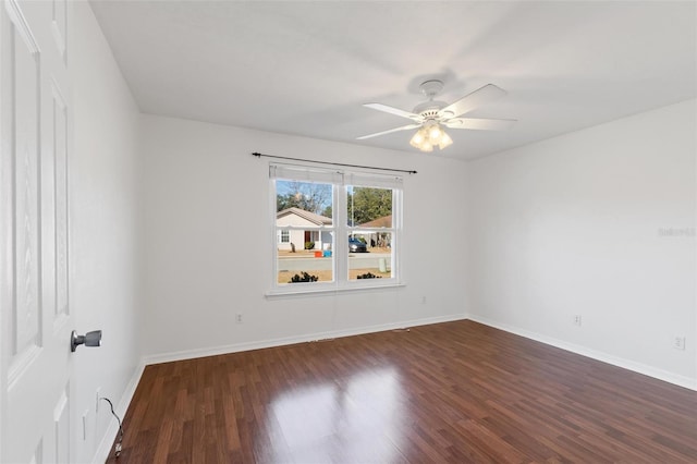 unfurnished room with dark wood-type flooring and ceiling fan