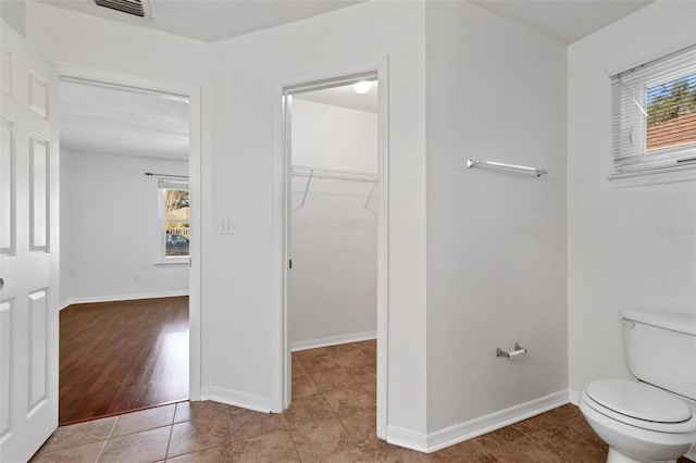 bathroom featuring tile patterned flooring and toilet