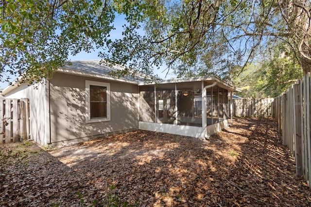 back of house with a sunroom