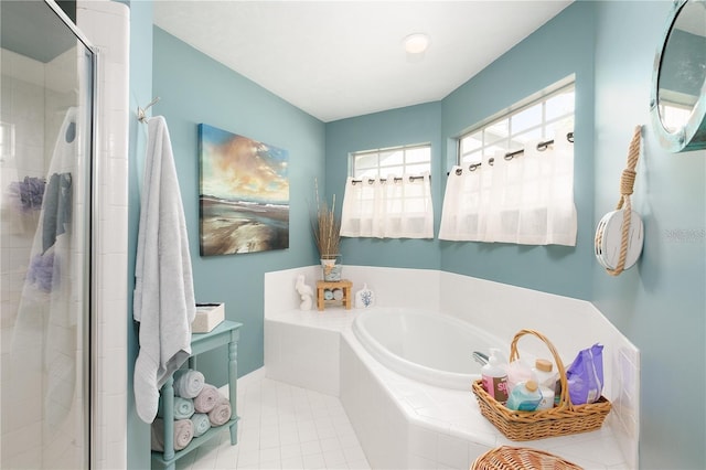 bathroom with independent shower and bath and tile patterned floors