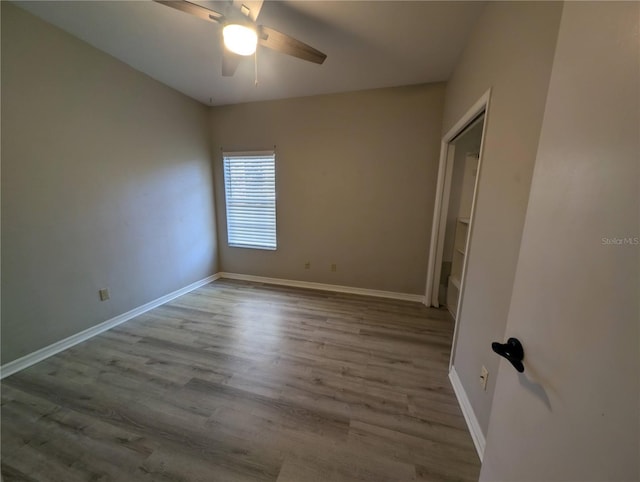 spare room with ceiling fan and light hardwood / wood-style flooring