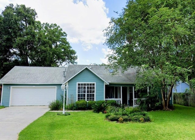 ranch-style house with a garage and a front lawn