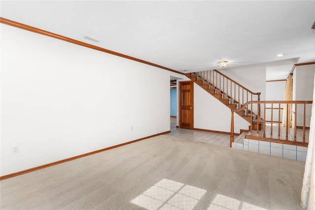 unfurnished living room with crown molding and light colored carpet