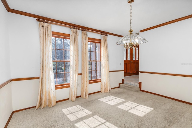 unfurnished dining area featuring crown molding, light colored carpet, and an inviting chandelier