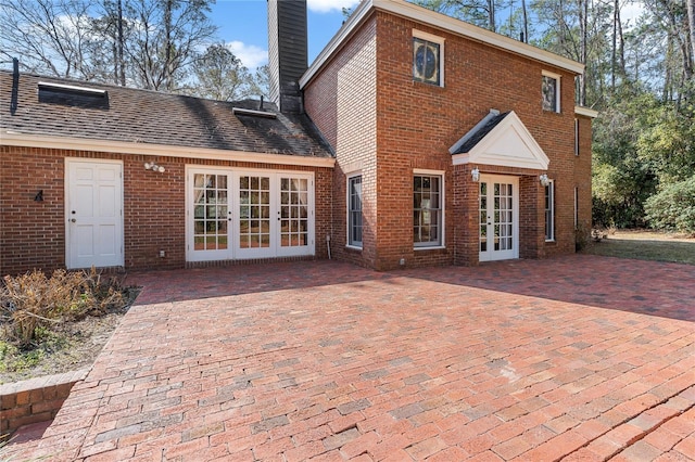 rear view of property featuring french doors