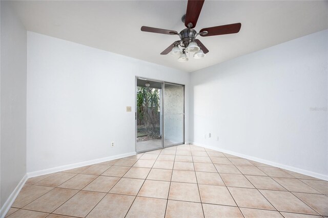 unfurnished room featuring ceiling fan and light tile patterned floors