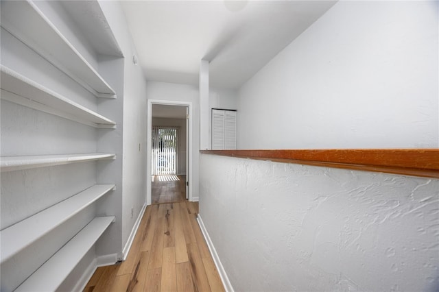 hall with light wood-type flooring