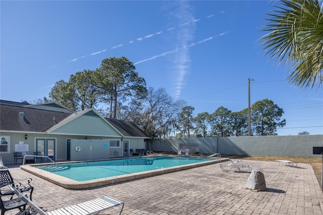 view of swimming pool with a patio area