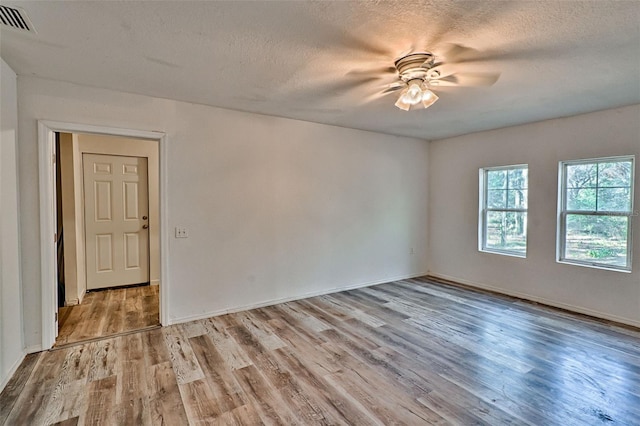 300 S US Highway 129, Bell, FL 32619 - unfurnished room with a textured ceiling and light hardwood / wood-style floors