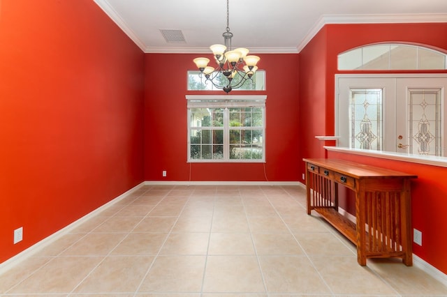 tiled empty room with crown molding, a chandelier, and french doors