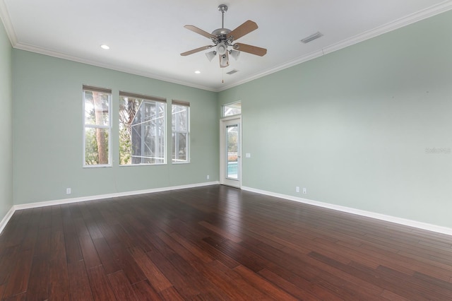 empty room with ceiling fan, ornamental molding, and dark hardwood / wood-style flooring