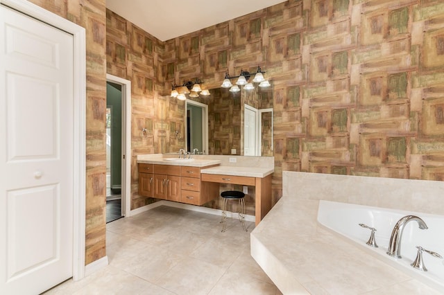 bathroom with vanity, tile patterned floors, and tiled bath