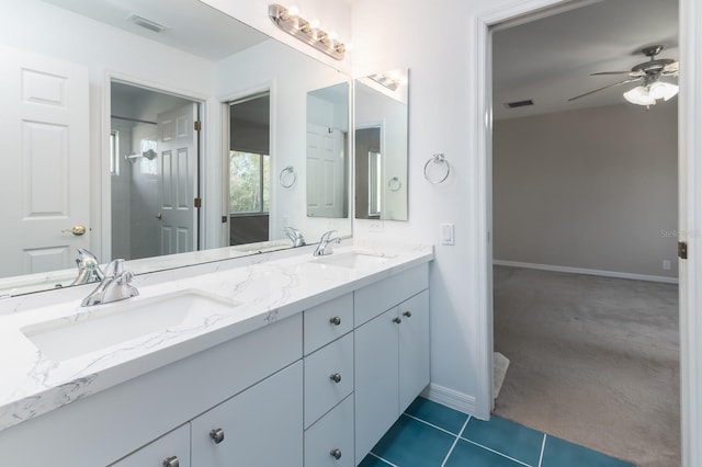 bathroom featuring vanity, tile patterned floors, and ceiling fan