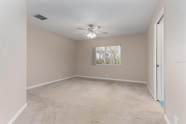 unfurnished room with light carpet and ceiling fan