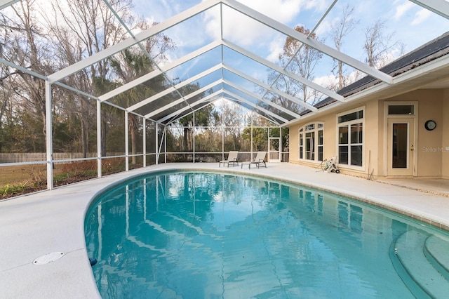 view of pool featuring a lanai and a patio area