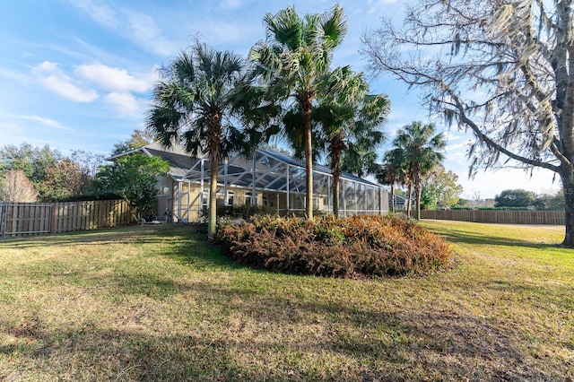 view of yard featuring glass enclosure