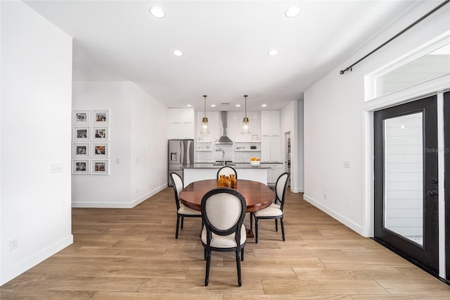 dining room with light hardwood / wood-style flooring