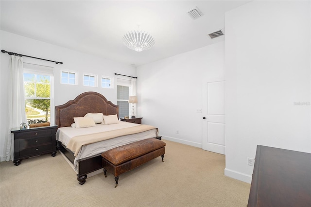 bedroom featuring light carpet