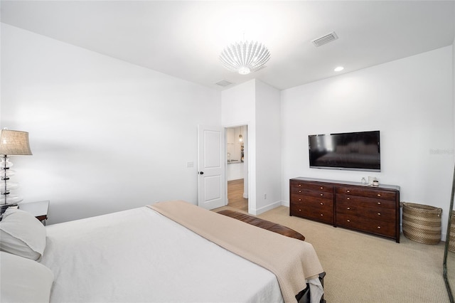 bedroom with light colored carpet