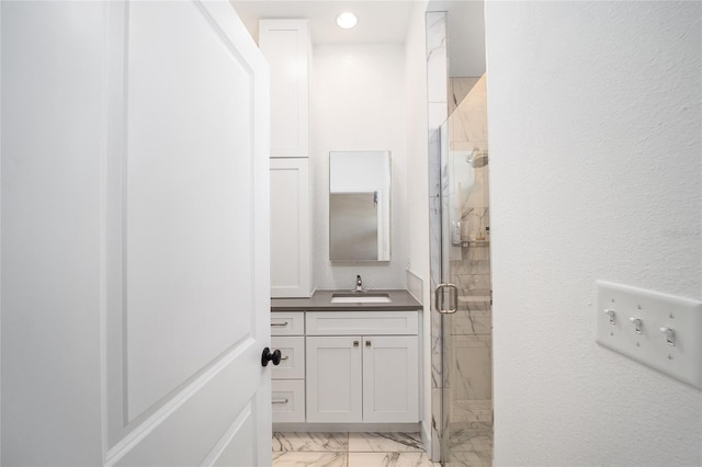 bathroom with vanity and walk in shower