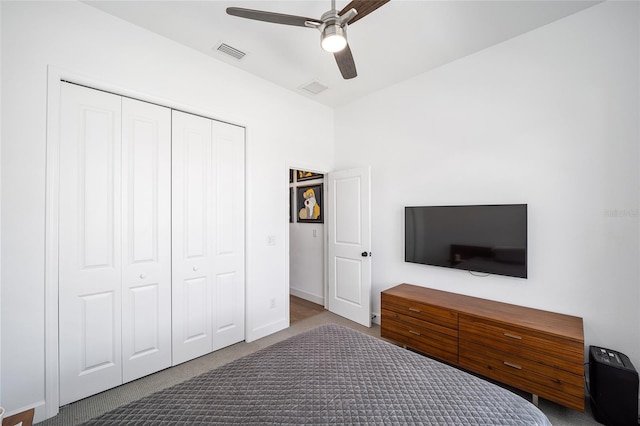 unfurnished bedroom featuring ceiling fan, carpet, and a closet