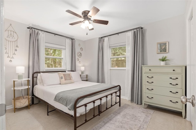 tiled bedroom with ceiling fan