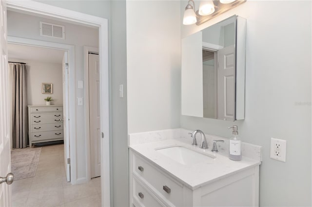 bathroom with vanity and tile patterned flooring