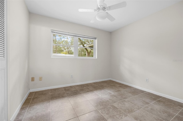 spare room with ceiling fan