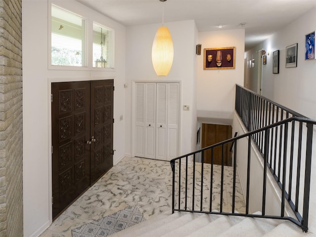 entryway featuring brick wall