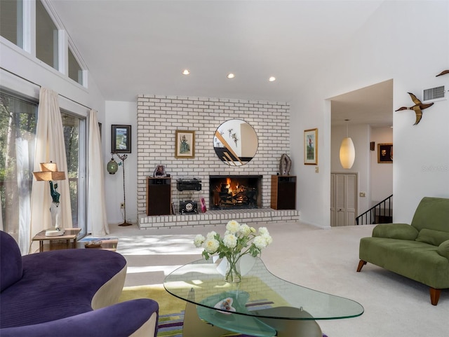 living room with recessed lighting, visible vents, a brick fireplace, carpet flooring, and high vaulted ceiling