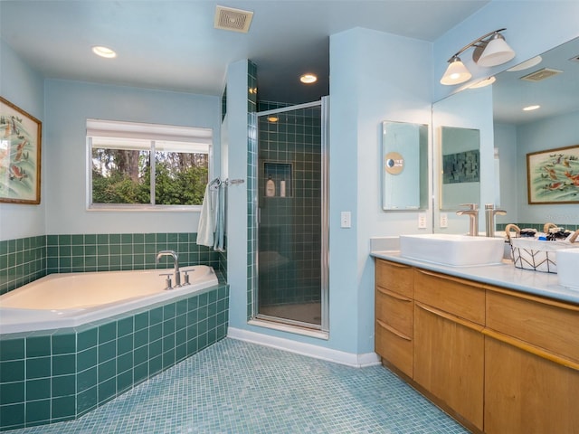 bathroom with a bath, a stall shower, visible vents, and tile patterned floors