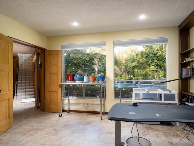 rec room featuring a textured ceiling and recessed lighting