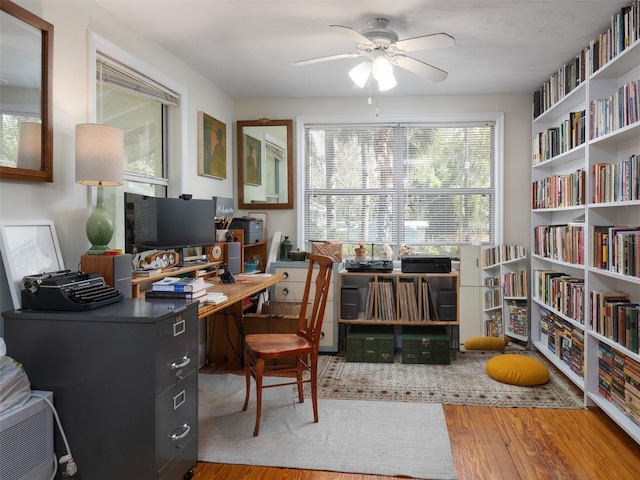 office area with wood finished floors and a ceiling fan