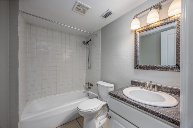 full bathroom with vanity, toilet, tile patterned floors, and tiled shower / bath