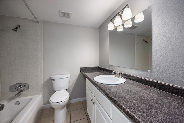 full bathroom with tiled shower / bath, vanity, toilet, and tile patterned flooring