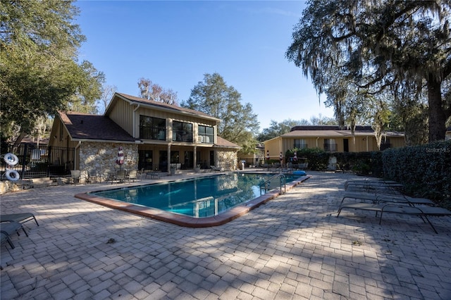 view of swimming pool featuring a patio