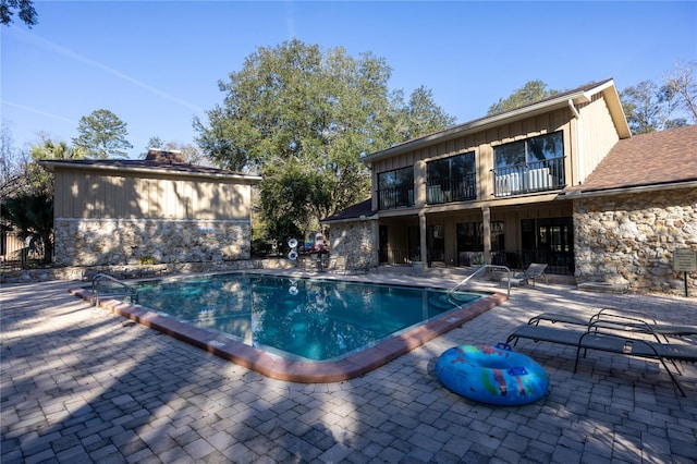 view of pool featuring a patio area