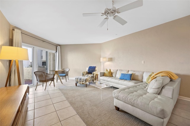 living room featuring ceiling fan and light tile patterned floors