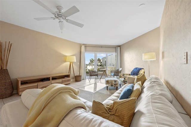 living room featuring light tile patterned floors and ceiling fan