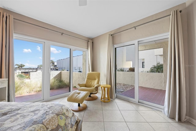 tiled bedroom featuring access to outside