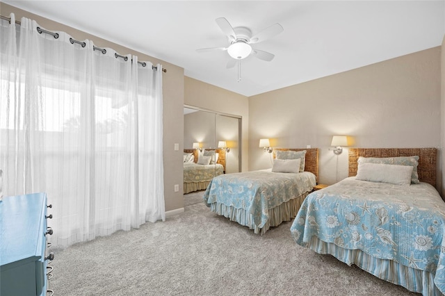 bedroom with carpet floors, a closet, and ceiling fan